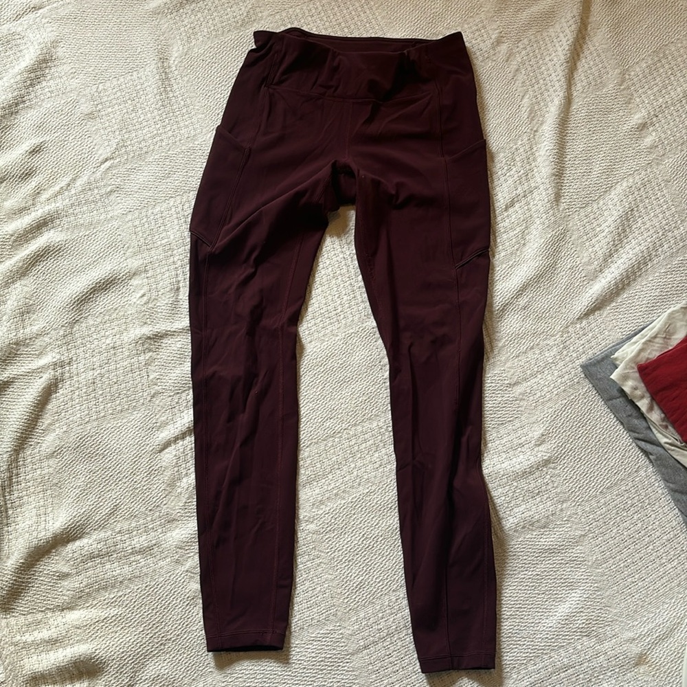 Lululemon Leggings Burgundy. Pockets on side & drawstring in waist.